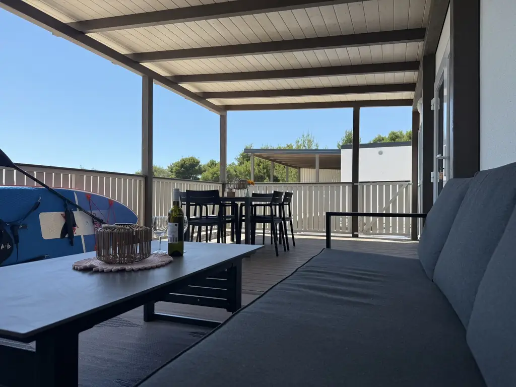 Terrace lounge with outdoor sofa and dining area